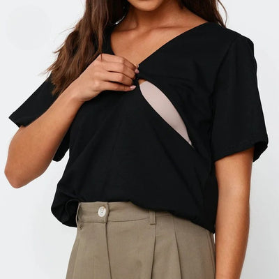 Black V-neck nursing tee worn by a breastfeeding mum with easy feeding access – Relievoo