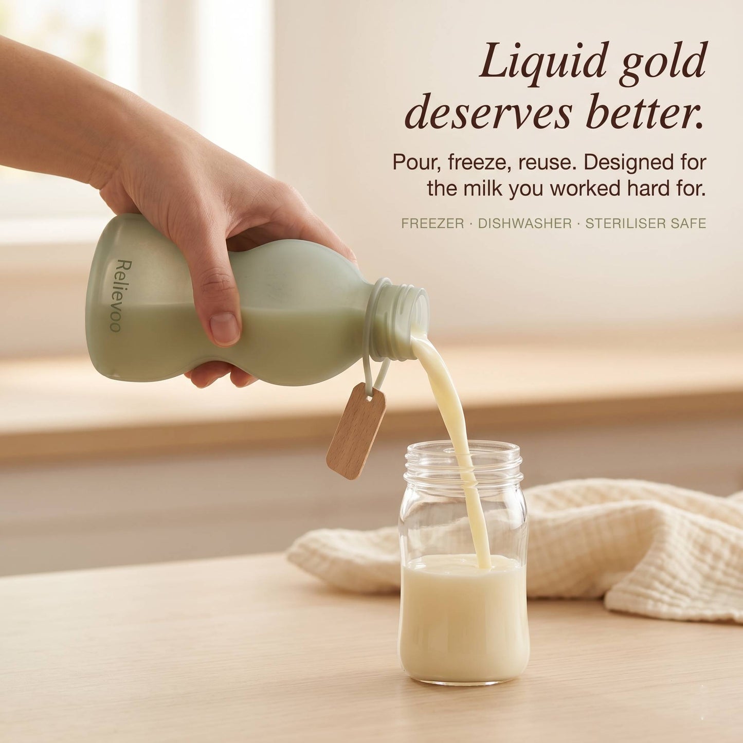 Mother pouring breast milk from sage green Relievoo silicone bottle — freezer dishwasher steriliser safe
