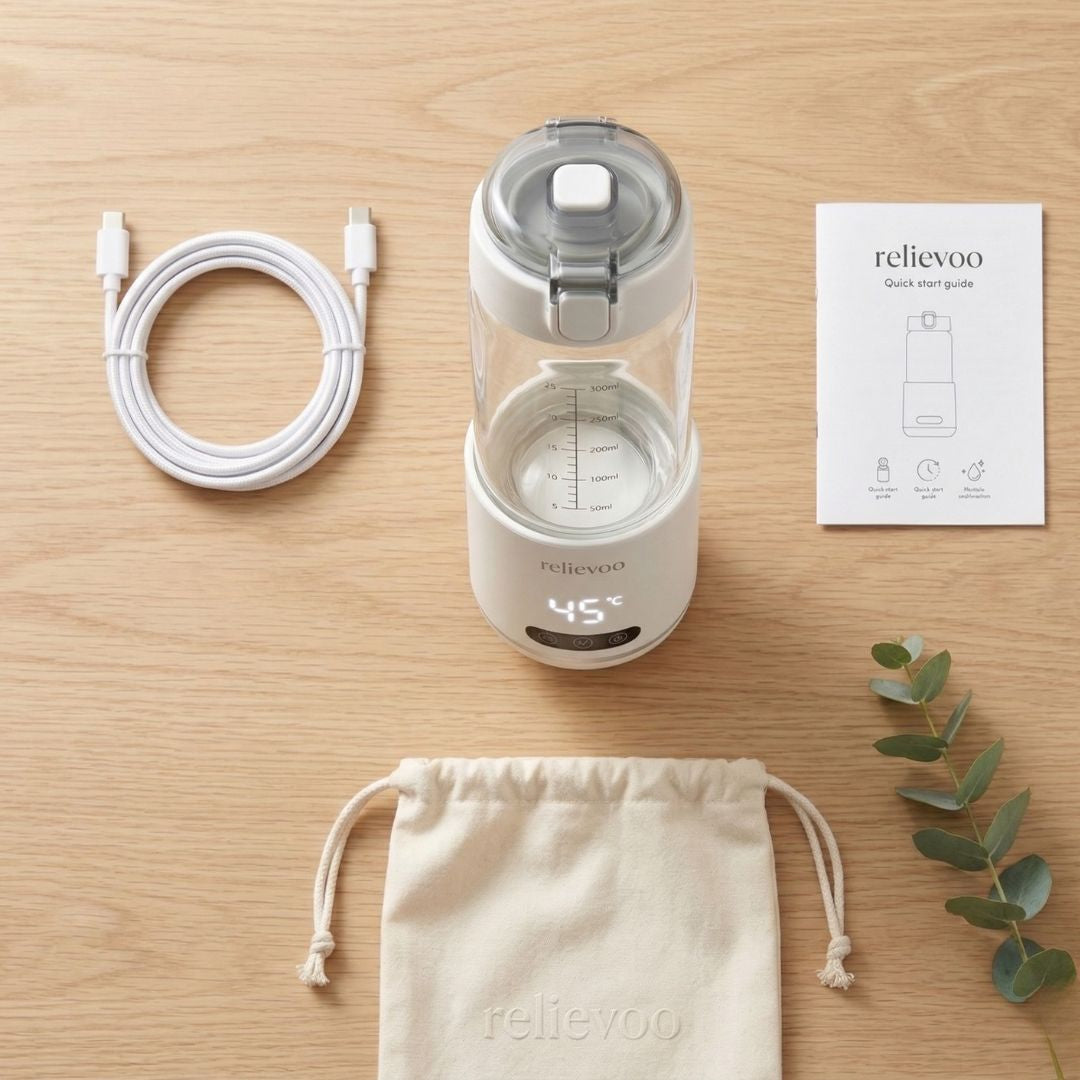 Relievoo Nomad bottle warmer unboxing flat lay showing warmer, USB-C cable, travel pouch and user guide
