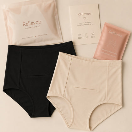 Relievoo Postpartum Soothing Briefs in black and ivory with hot & cold therapy pack and gift packaging