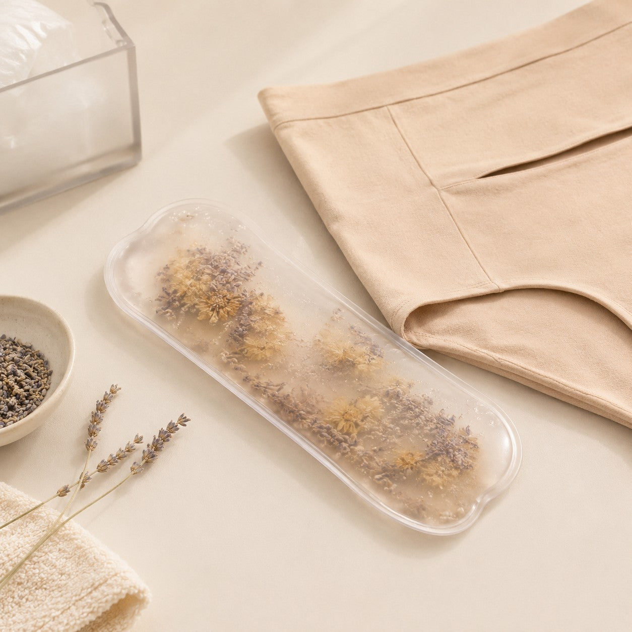 Lavender and chamomile hot & cold therapy pack next to the nude postpartum soothing briefs