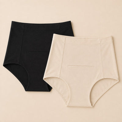 Relievoo Postpartum Soothing Briefs twin pack, one black and one ivory high-waisted brief laid flat