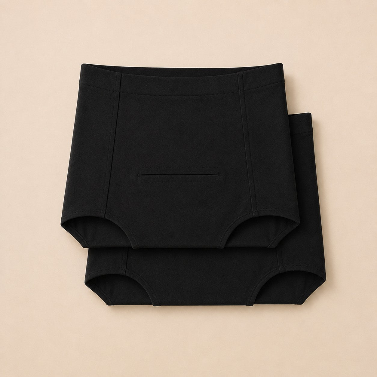 Twin pack of two black postpartum soothing briefs, folded and stacked