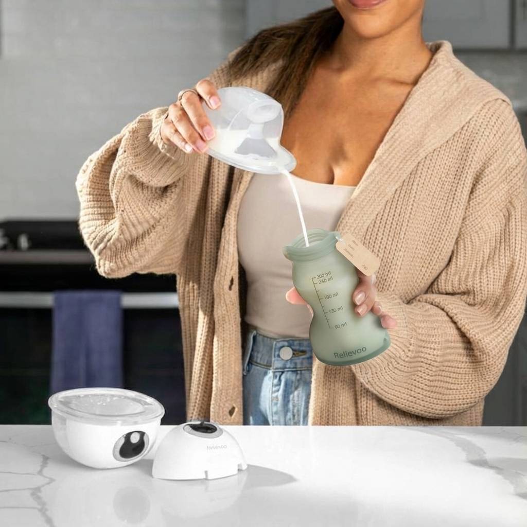 UK mum pouring breast milk from Relievoo wearable pump into a reusable silicone storage pouch — eco-friendly closed-system collection, 260ml capacity