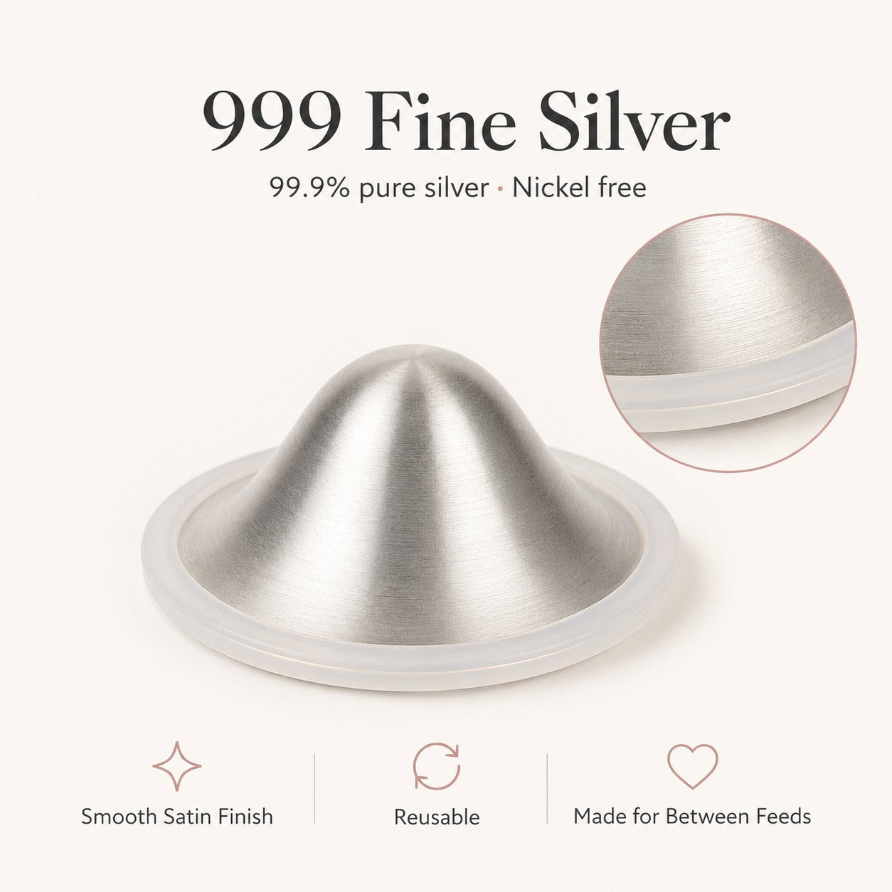 Close-up of a brushed 999 fine silver nursing cup showing its satin dome and clear silicone rim rvpumpen