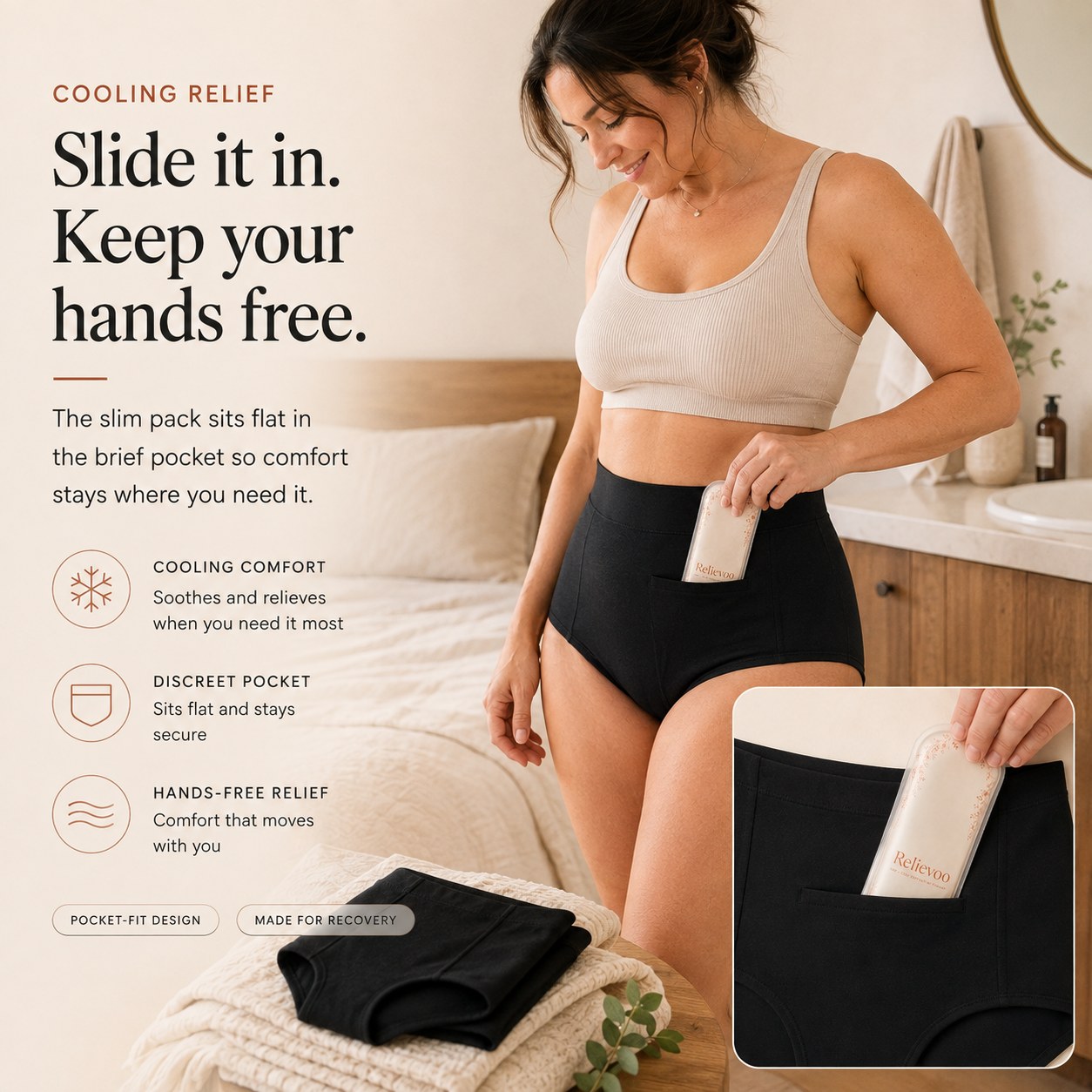 Woman sliding the slim Relievoo therapy pack into the front pocket of the black soothing briefs