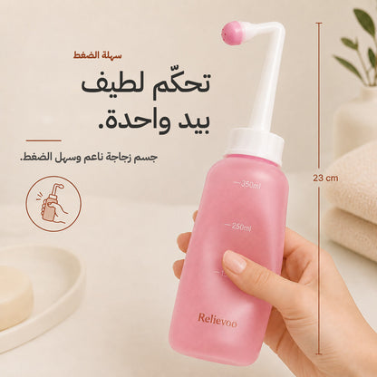 Hand squeezing the 23 cm Relievoo peri bottle with one hand
