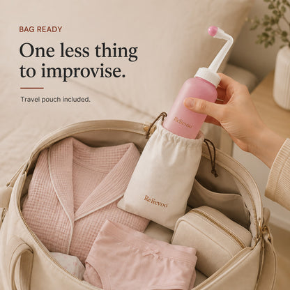 Hand slipping the Relievoo peri bottle into its travel pouch inside a packed hospital bag