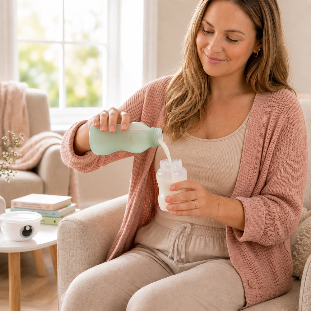 Mum pouring stored breast milk from a Relievoo bottle into a baby feeding bottle