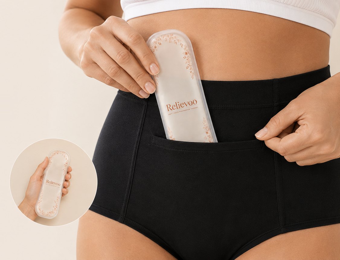 Close-up of the slim Relievoo therapy pack being slipped into the pocket of the black soothing briefs