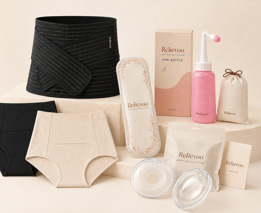 The Relievoo postpartum recovery essentials bundle laid out together: belly band, two briefs, therapy pack, peri bottle and two milk collectors