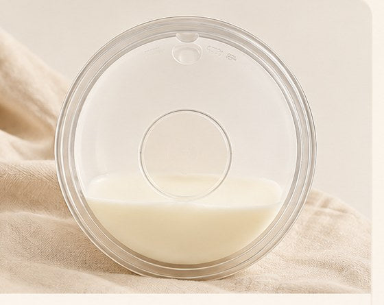 Relievoo breast milk collector holding the letdown collected during a feed